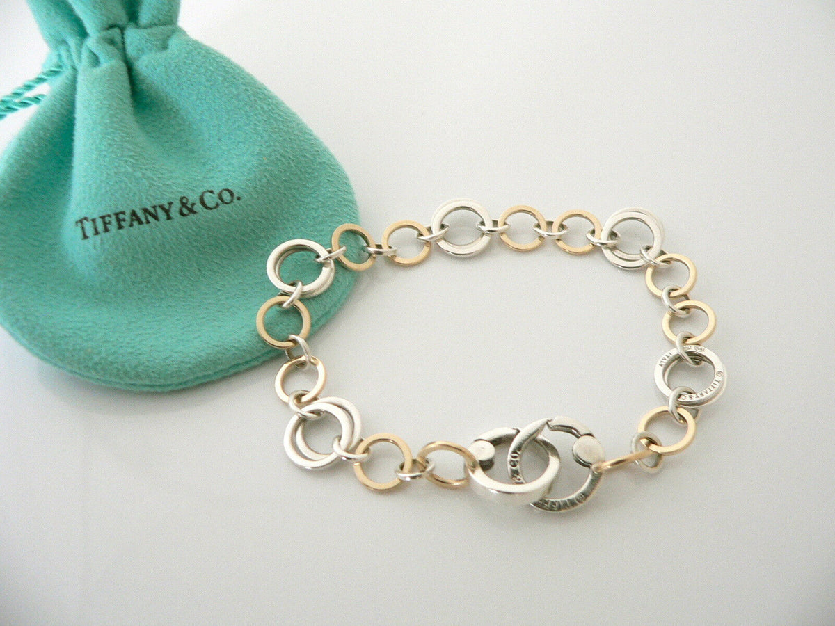 Tiffany & Co 18K Gold 5-Charm Link Bracelet Golden Metal ref.1025347 - Joli  Closet