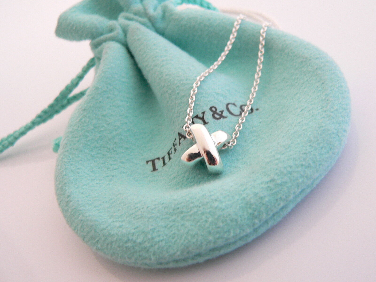 Tiffany Notes alphabet disc charm in silver on a chain. Letters A-Z  available. | Tiffany & Co.